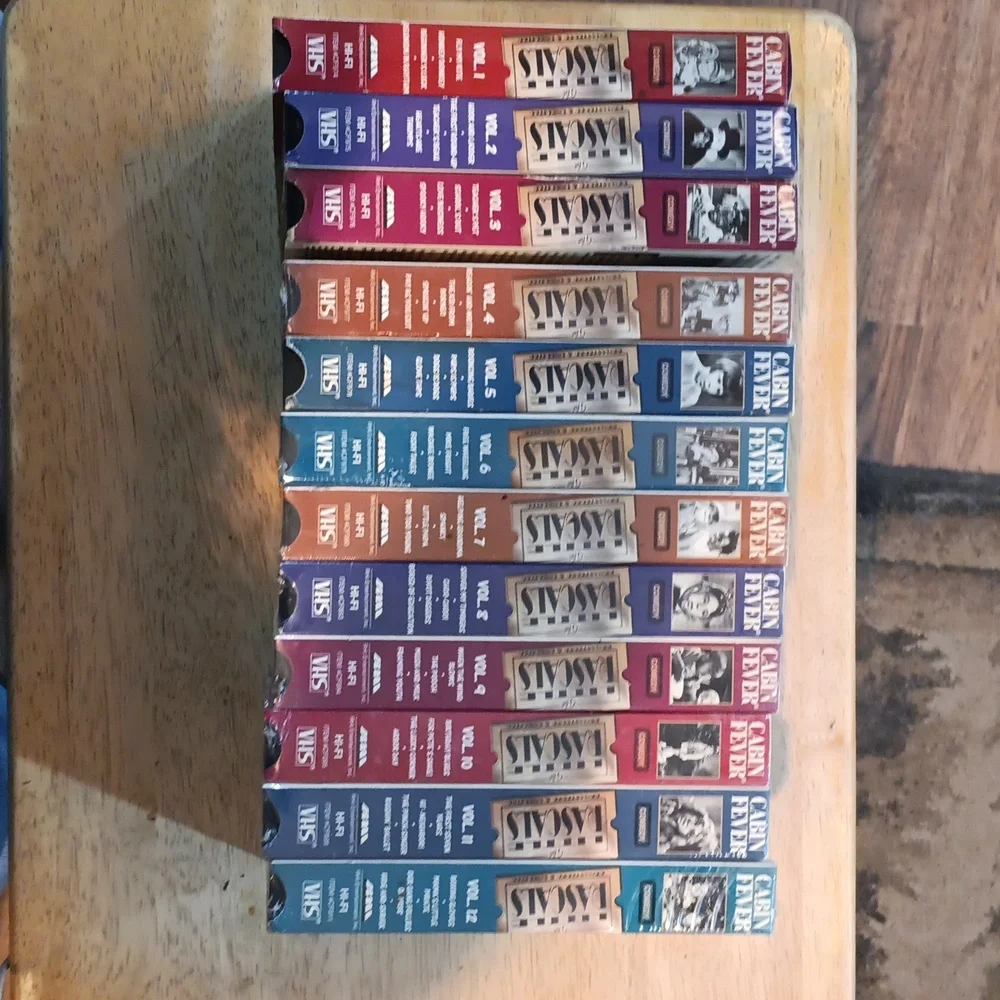 Classic VHS Tape Collection with Colorful Spines 12 Volumes
